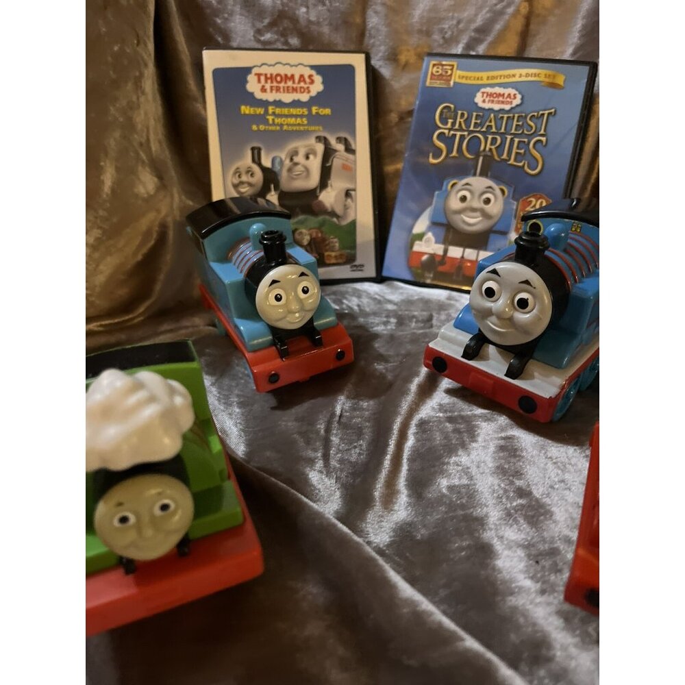 Thomas the Tank Engines, 4 toys , & 2 dvds see all photos nice for lost trains